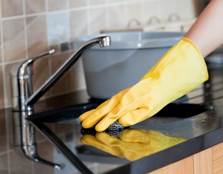 Kitchen and bathroom detailing during move-in cleaning in Holland Park